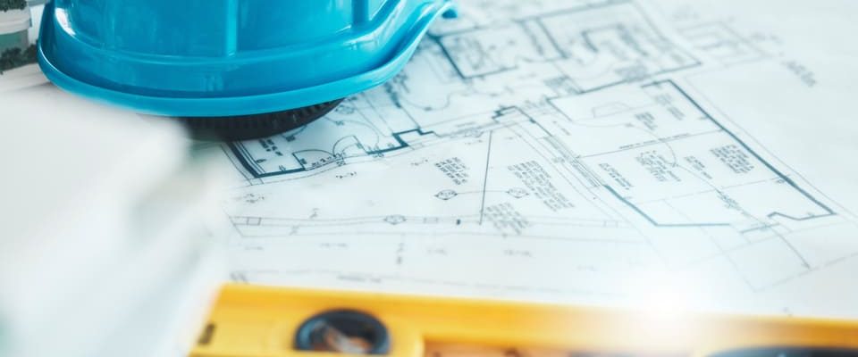architecture-blueprint-and-plan-construction-and-2026-01-09-11-13-53-utc Safety helmet, level, and design drawings